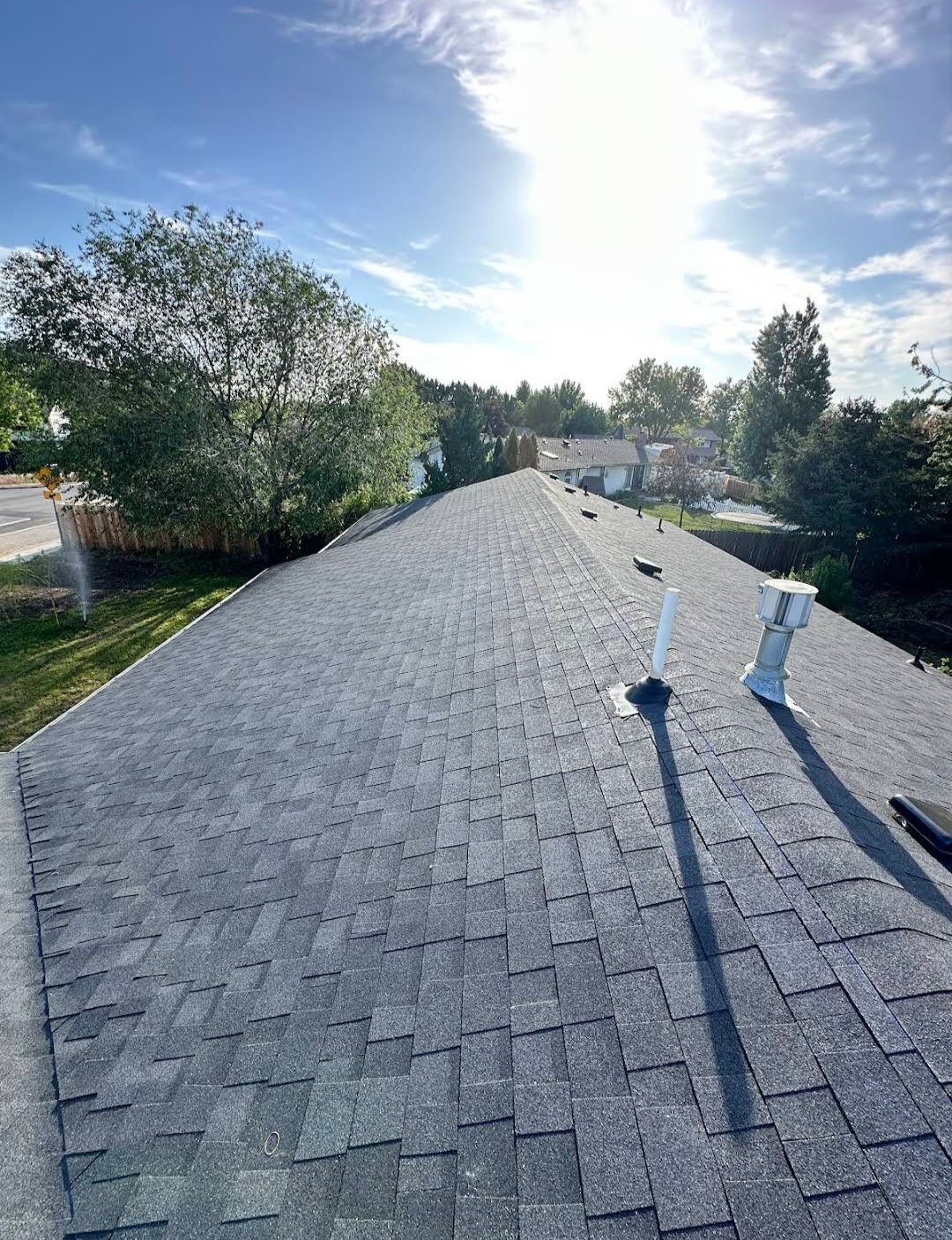 Freshly installed gray architectural shingles on Blake's residential roof