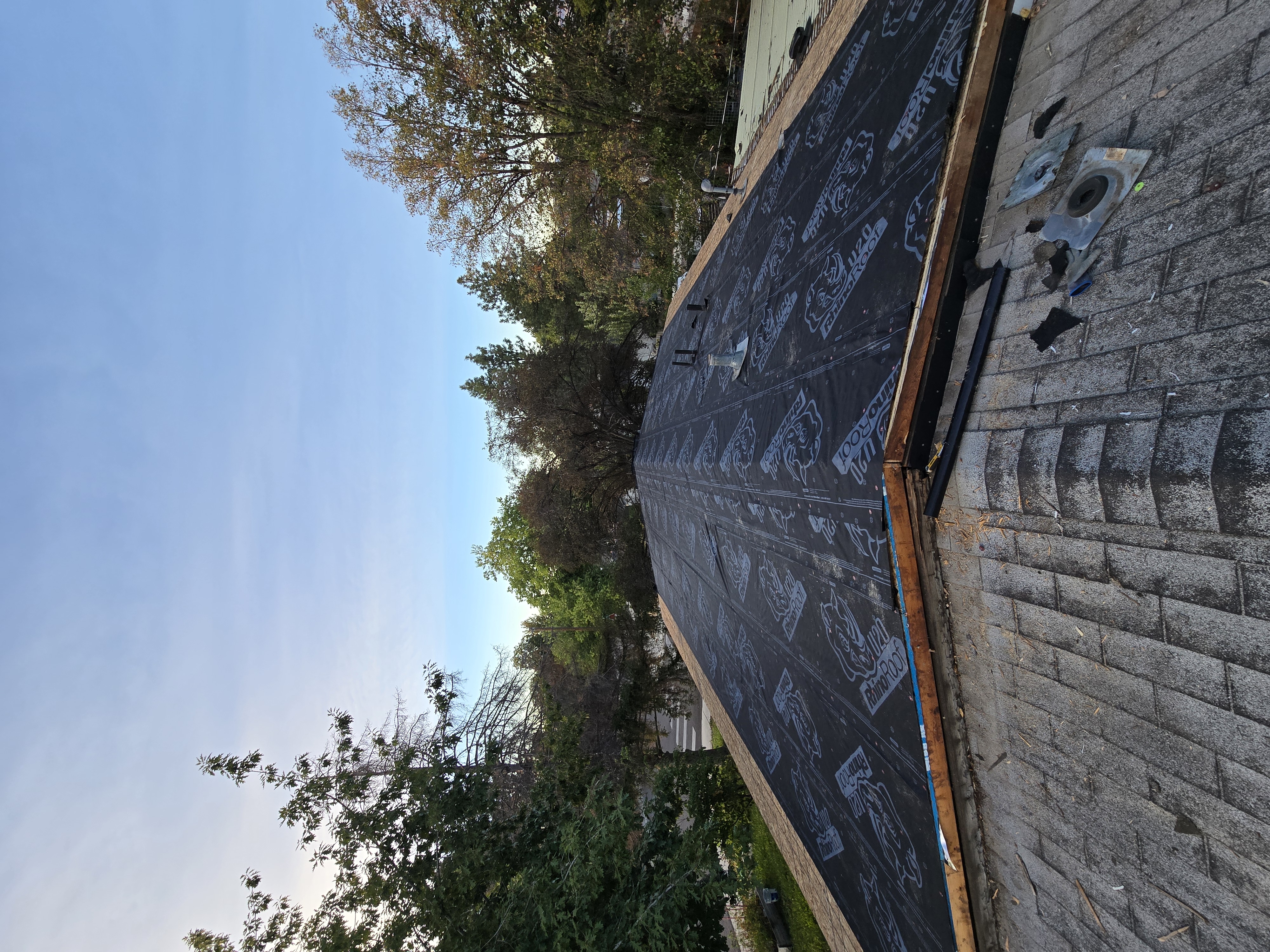 New waterproofing underlayment installed on a roof deck
