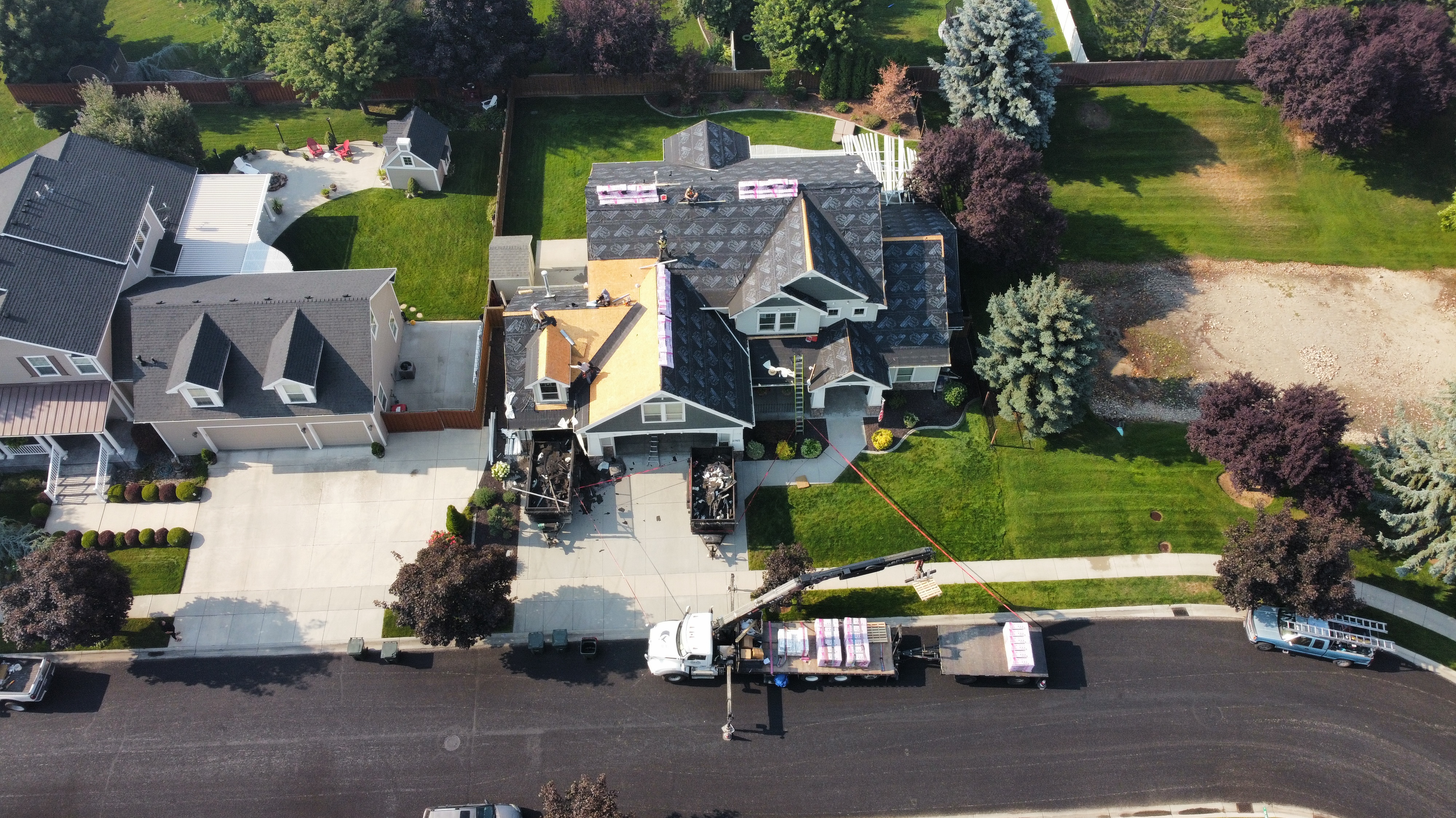 Drone view of a full tear-off down to bare wood decking