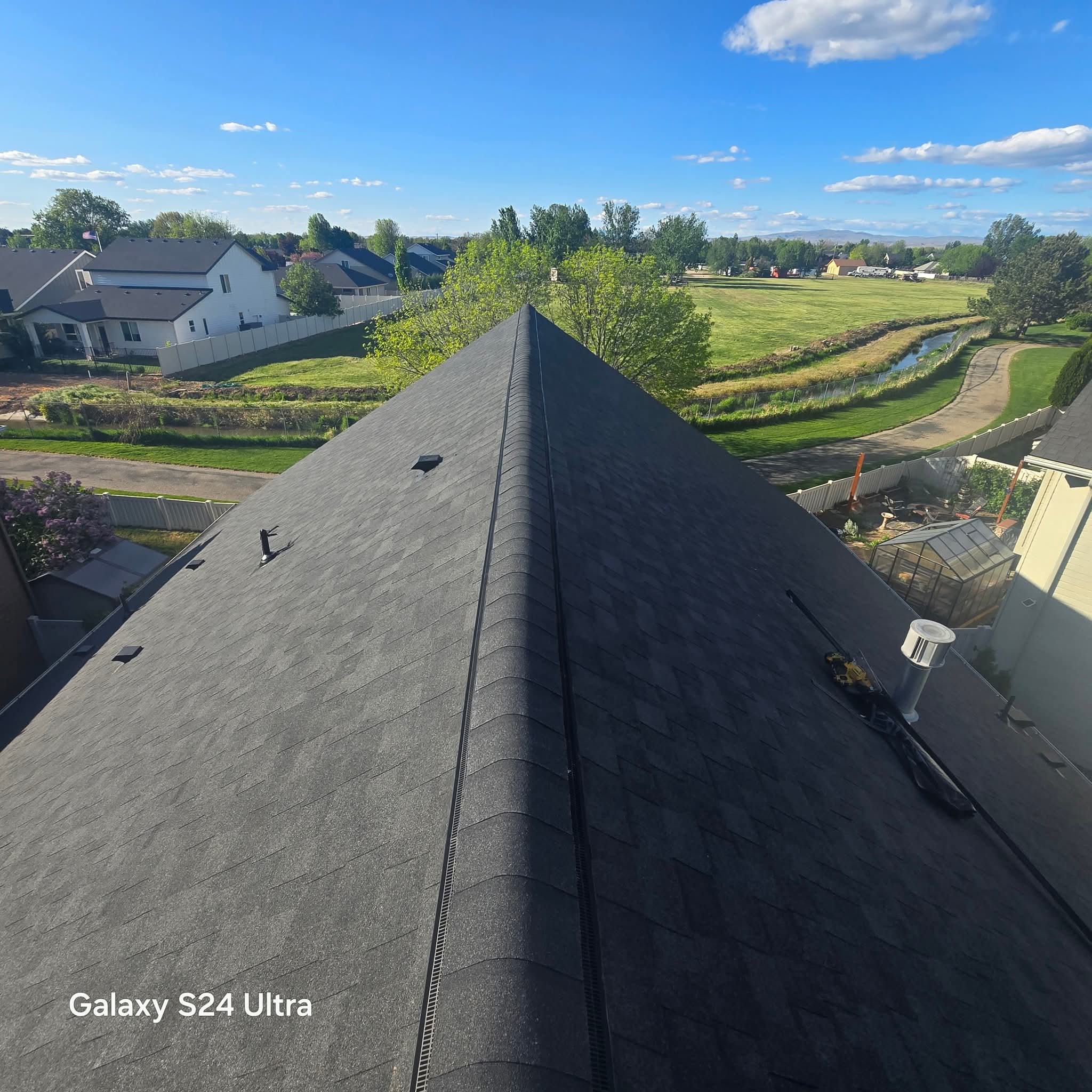 New architectural shingle roof with ridge vent on a Meridian home