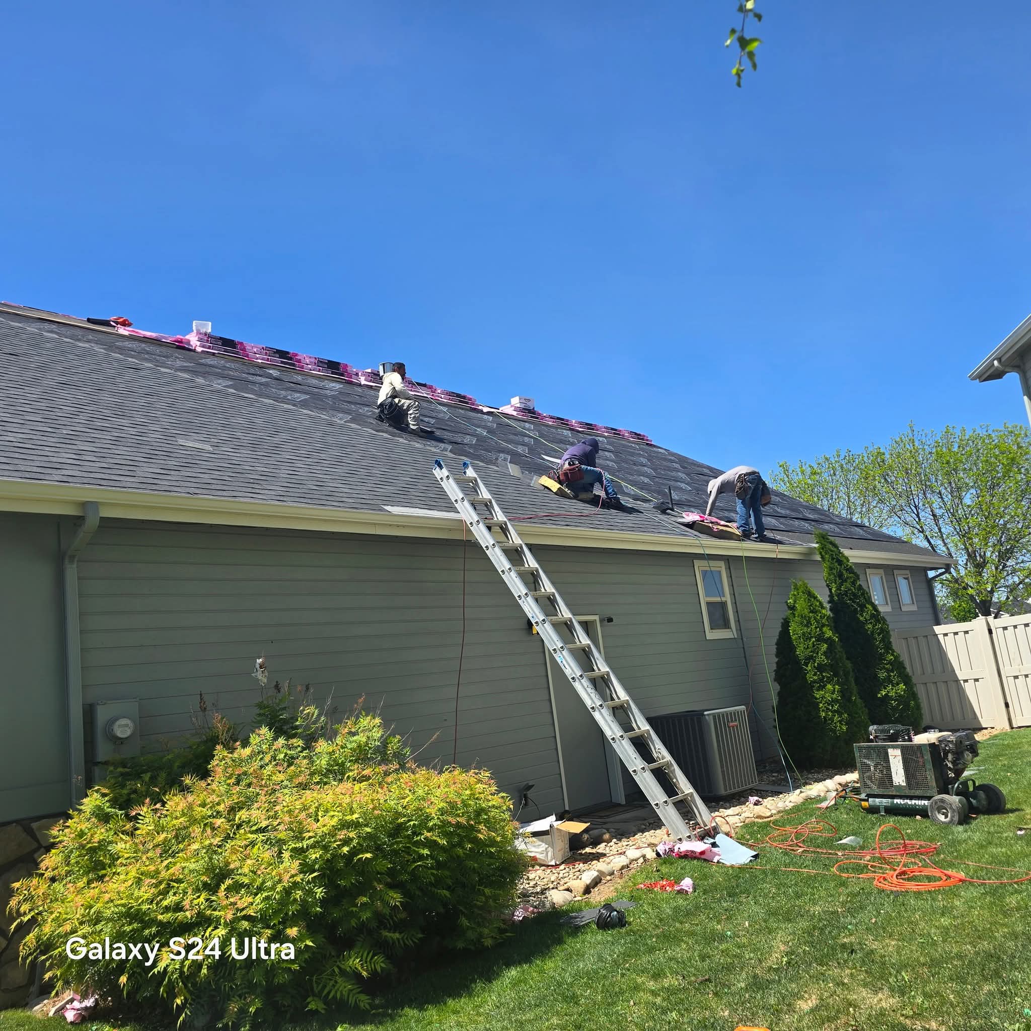 High Command Roofing crew installing shingles on a Meridian home